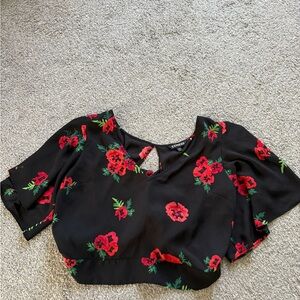 Express Black Blouse with Red Floral Pattern